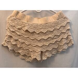 Woman's bohemian-inspired shorts featuring scalloped crochet details size medium